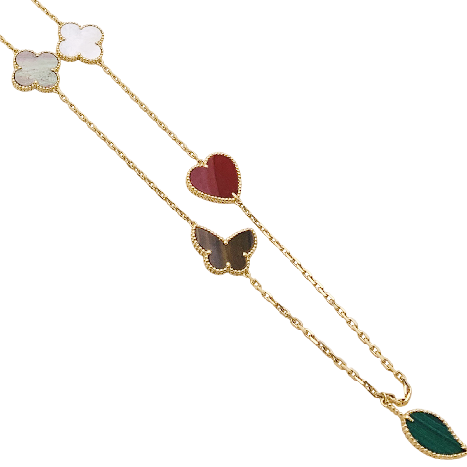 Collier-Sautoir Van Cleef & Arpels, "Lucky Alhambra", or jaune, cornaline, malachite, oeil de tigre, nacre. 3