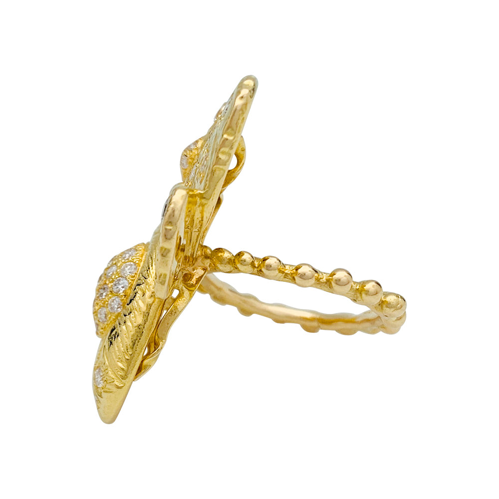 Une bague Garnazelle figurant un papillon en or jaune 750/000, rehaussé de diamants taille brillant. Poids brut: 20 grammes 3