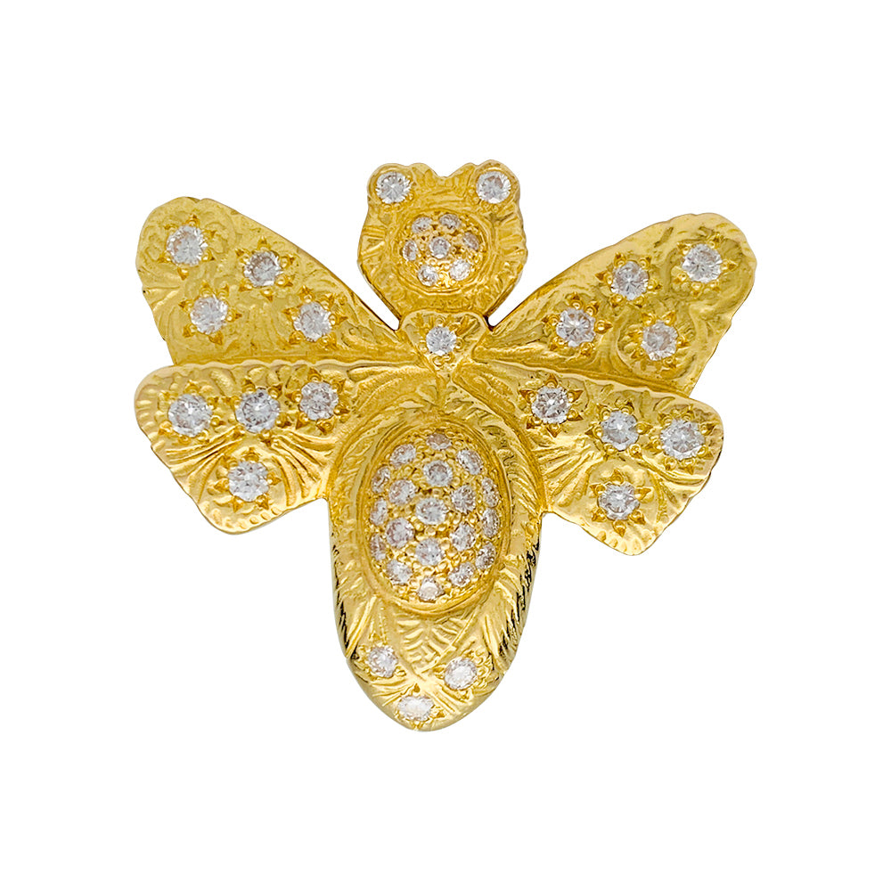 Une bague Garnazelle figurant un papillon en or jaune 750/000, rehaussé de diamants taille brillant. Poids brut: 20 grammes 6