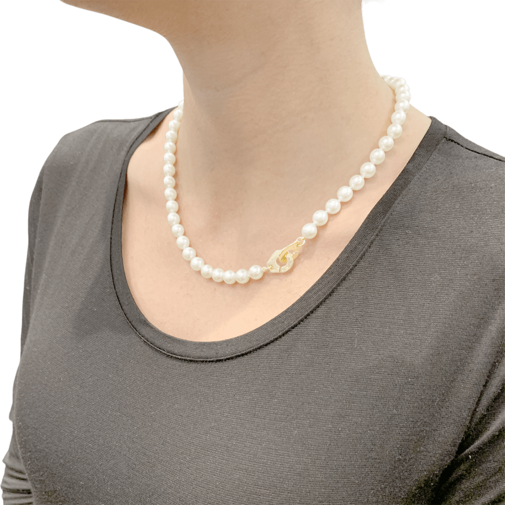 Collier de perles Dinh Van, "Menottes R12", en or jaune. 6