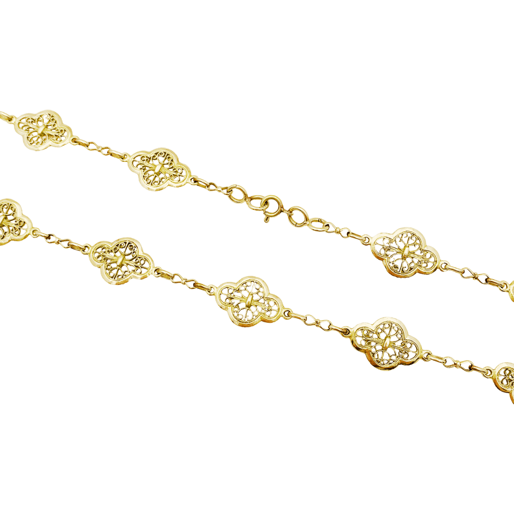 Sautoir motifs filigranés en or jaune. 5