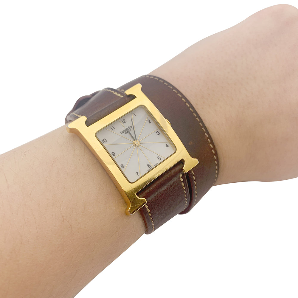 Montre Hermès,"Heure H", plaqué or, acier sur cuir. 1