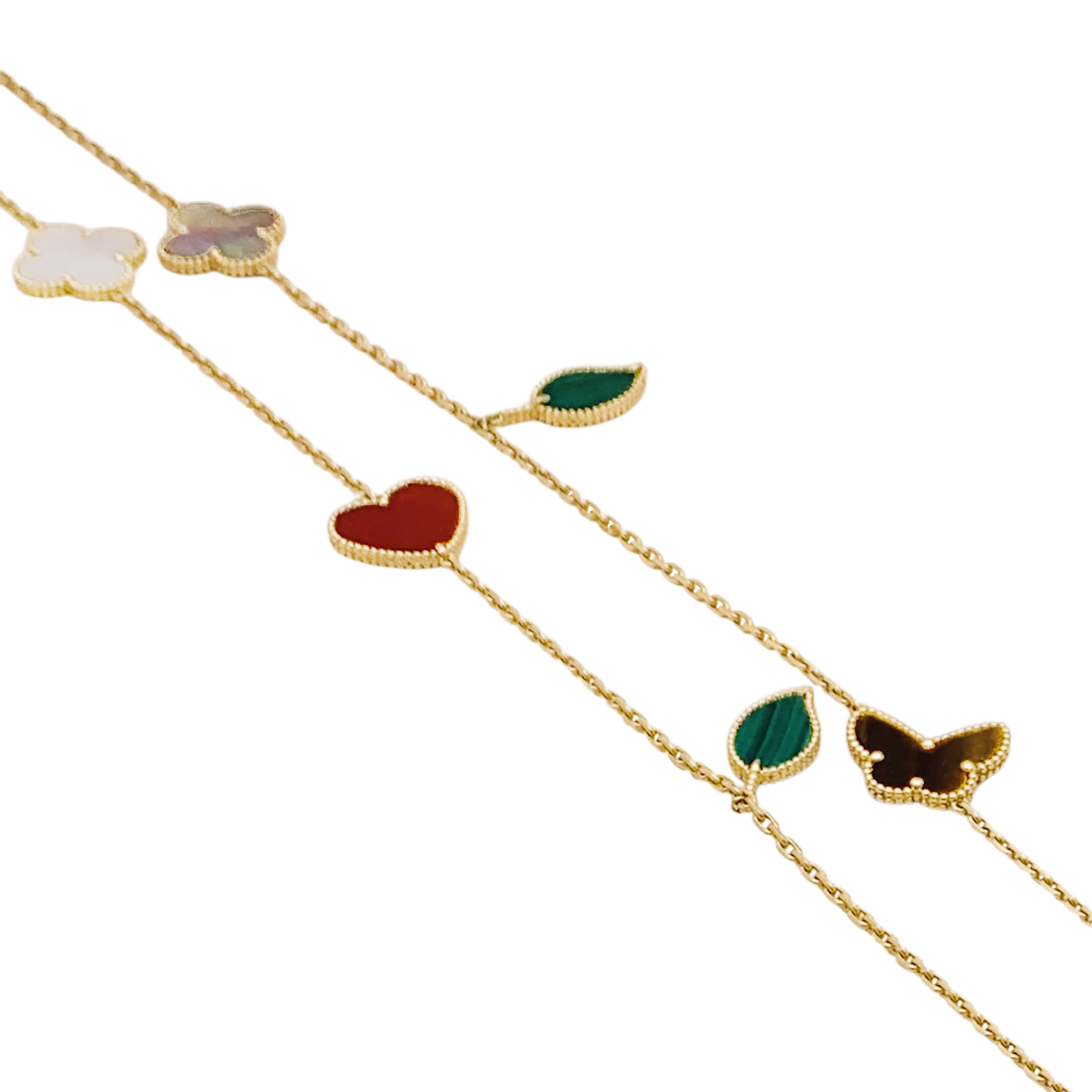 Collier-Sautoir Van Cleef & Arpels, "Lucky Alhambra", or jaune, cornaline, malachite, oeil de tigre, nacre. 2