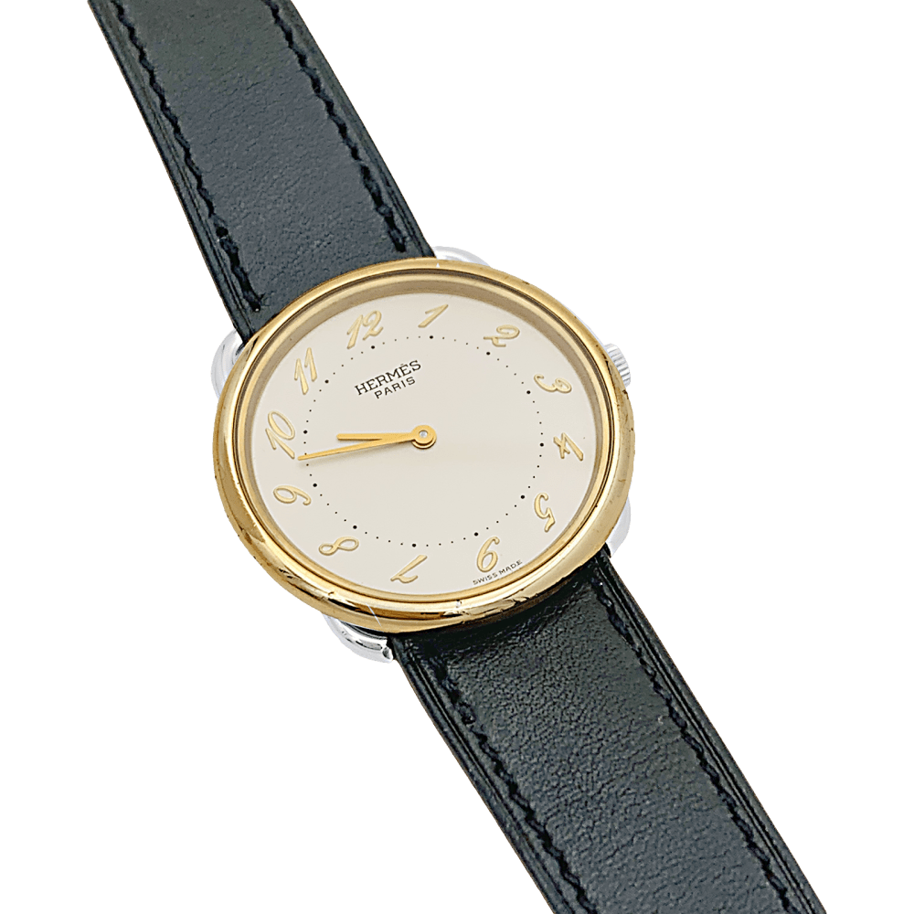 Montre HERMÈS, "Arceau", plaqué or et acier. 2