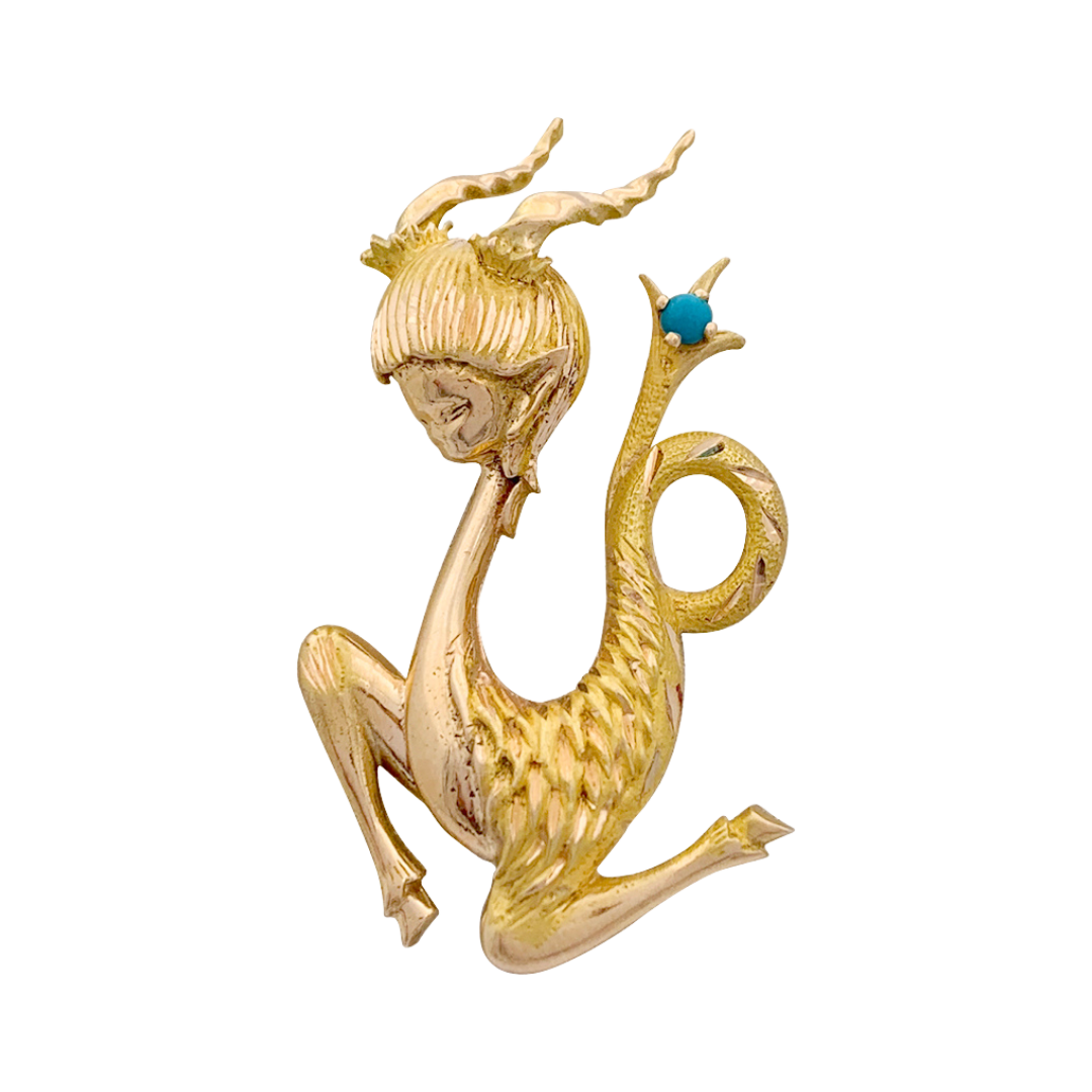 Broche vintage "Capricorne", or jaune, turquoise.