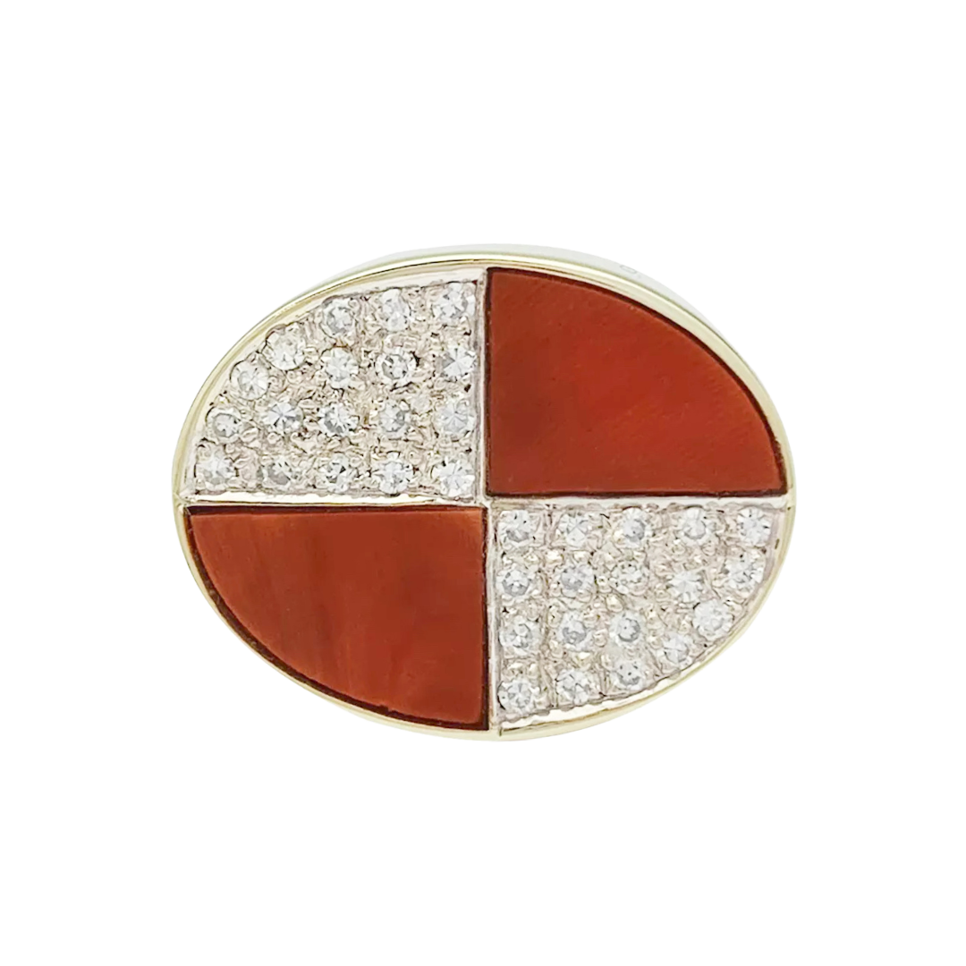 Vintage signet ring in two golds, coral and diamonds.