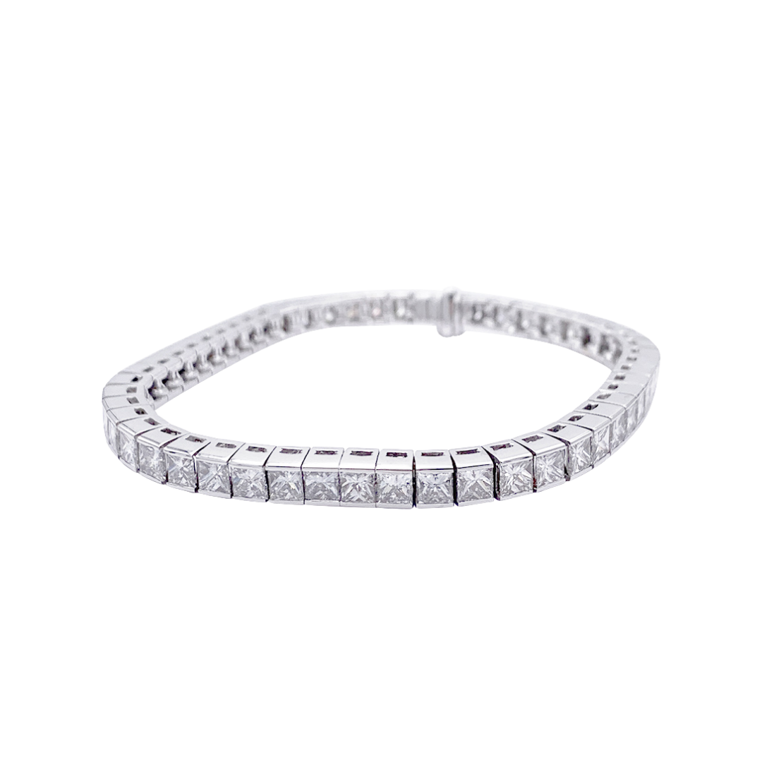 White gold line bracelet with princess-cut diamonds.