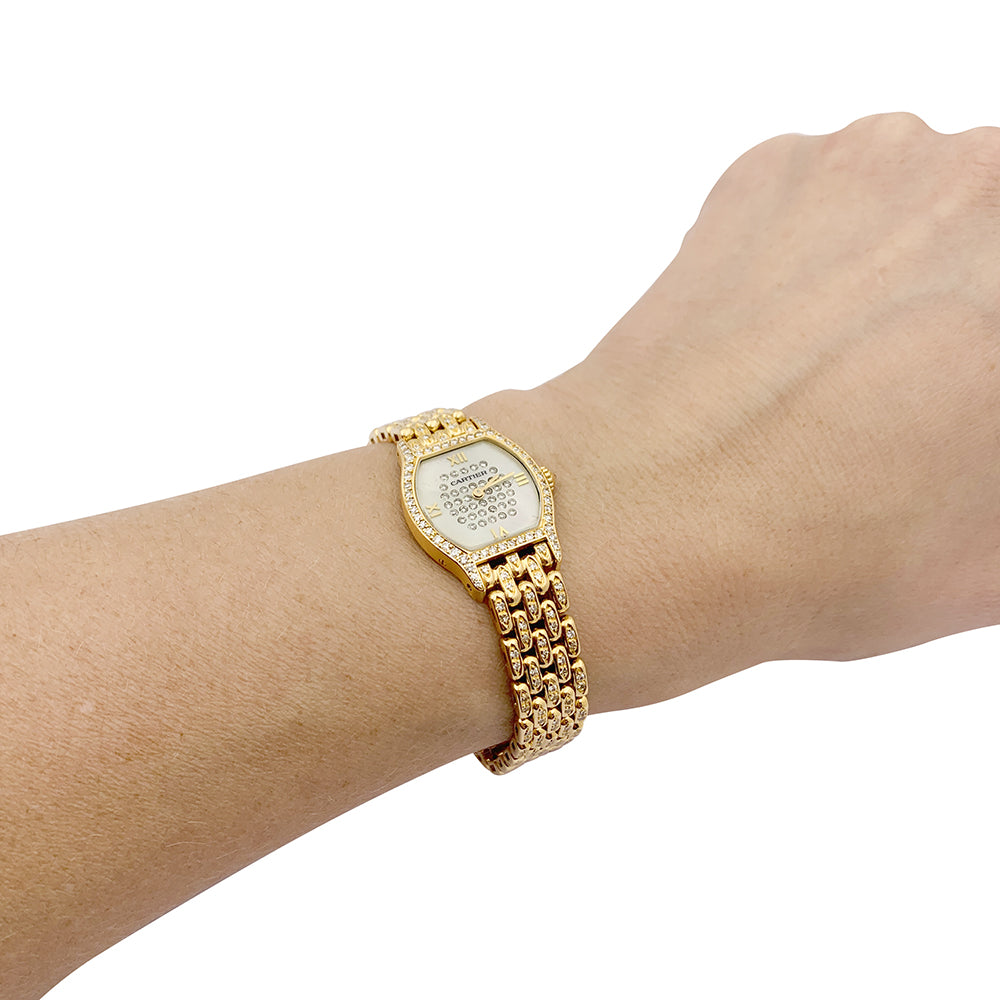 Montre Cartier "Tortue" or jaune, diamants, nacre. 1