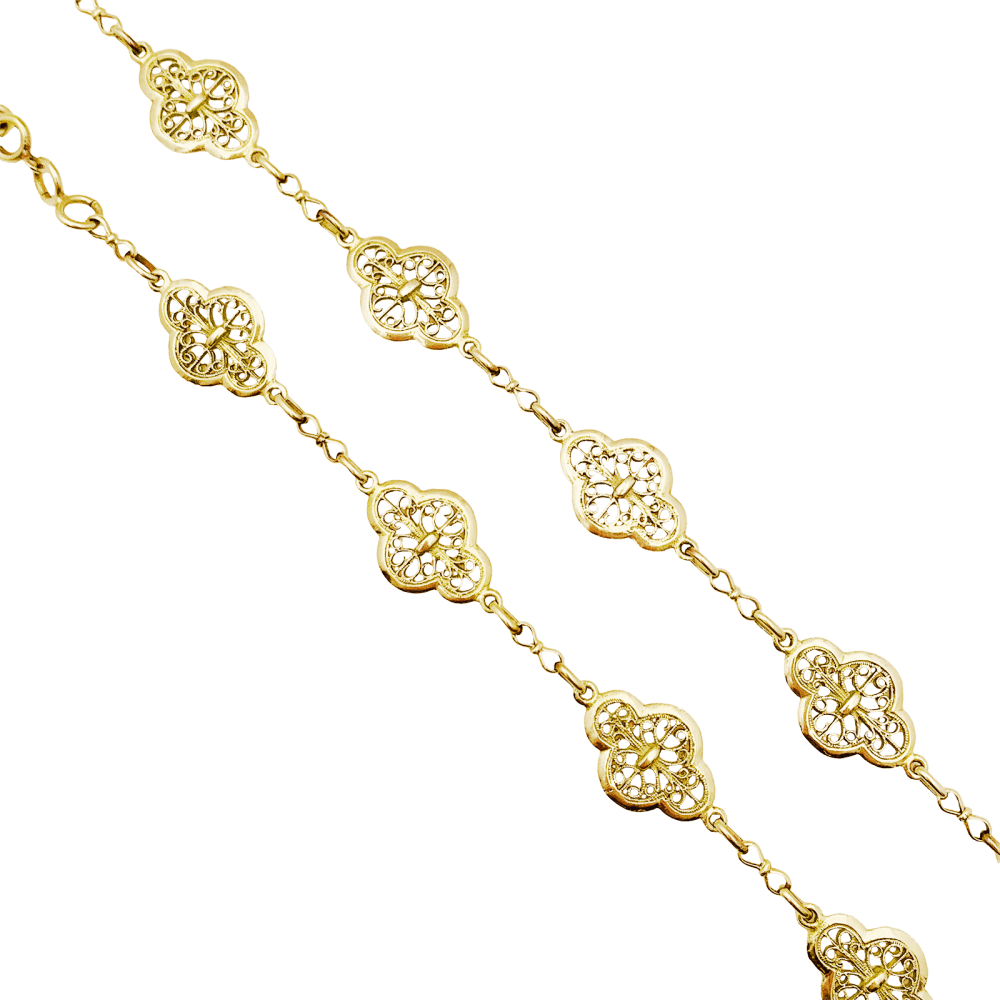 Sautoir motifs filigranés en or jaune. 6