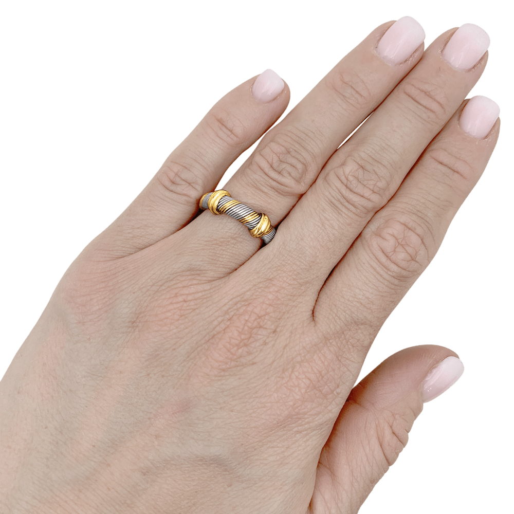 Bague Cartier, "Trinity", trois tons d'or et acier. 5