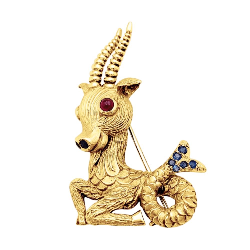 Broche-clip, "Capricorne", or jaune, rubis, saphirs. 1