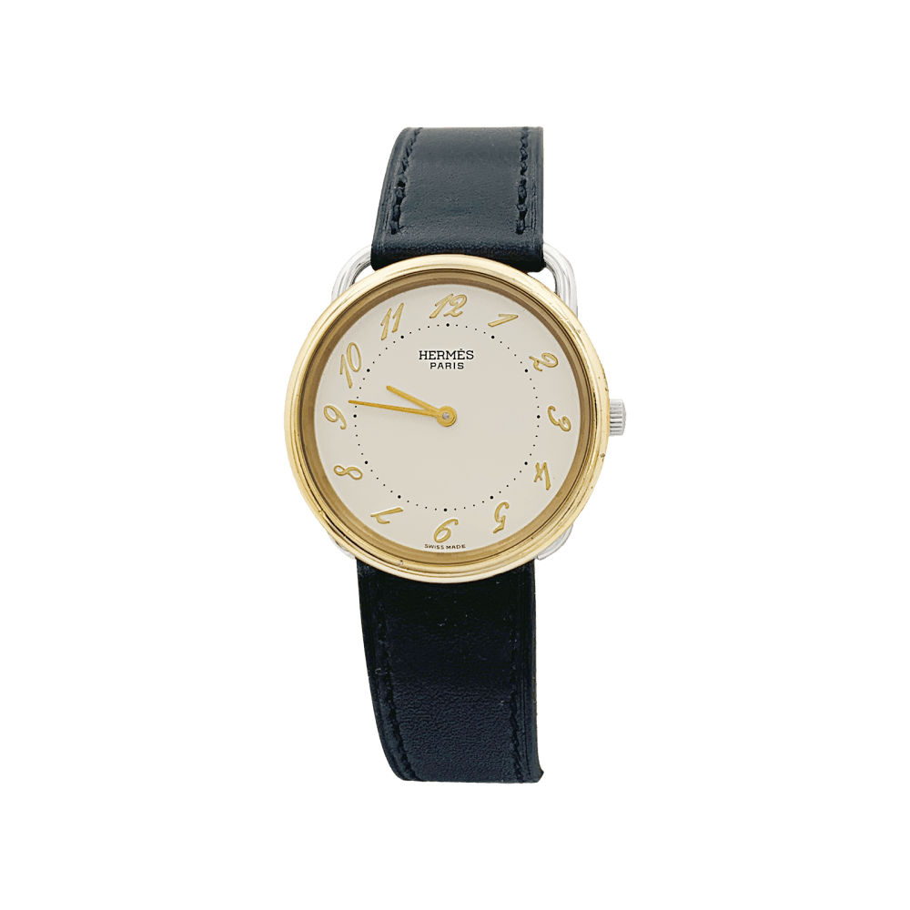 Montre HERMÈS, "Arceau", plaqué or et acier. 1