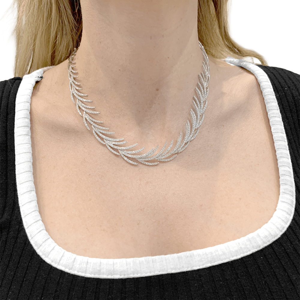 Collier "Palmes" or blanc, diamants.  4