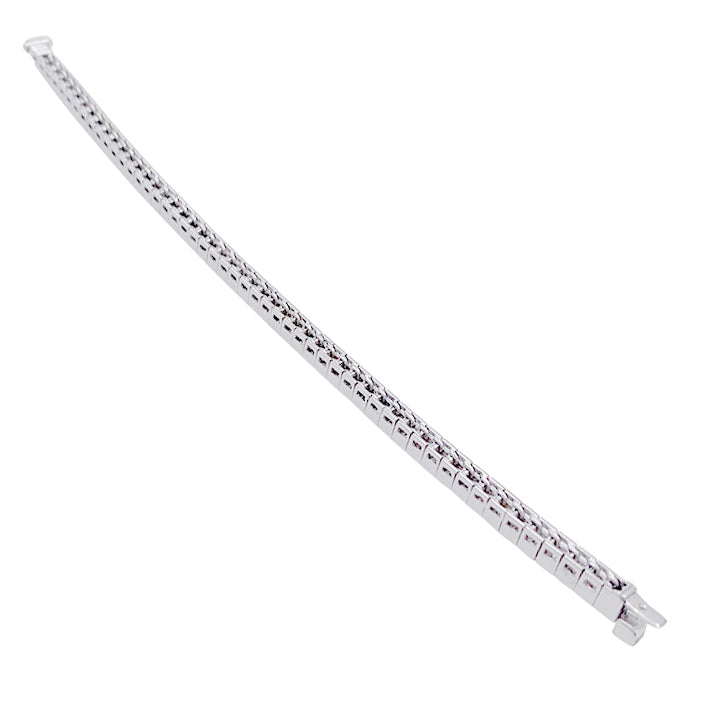 Bracelet ligne or blanc et diamants taille princesse. 5
