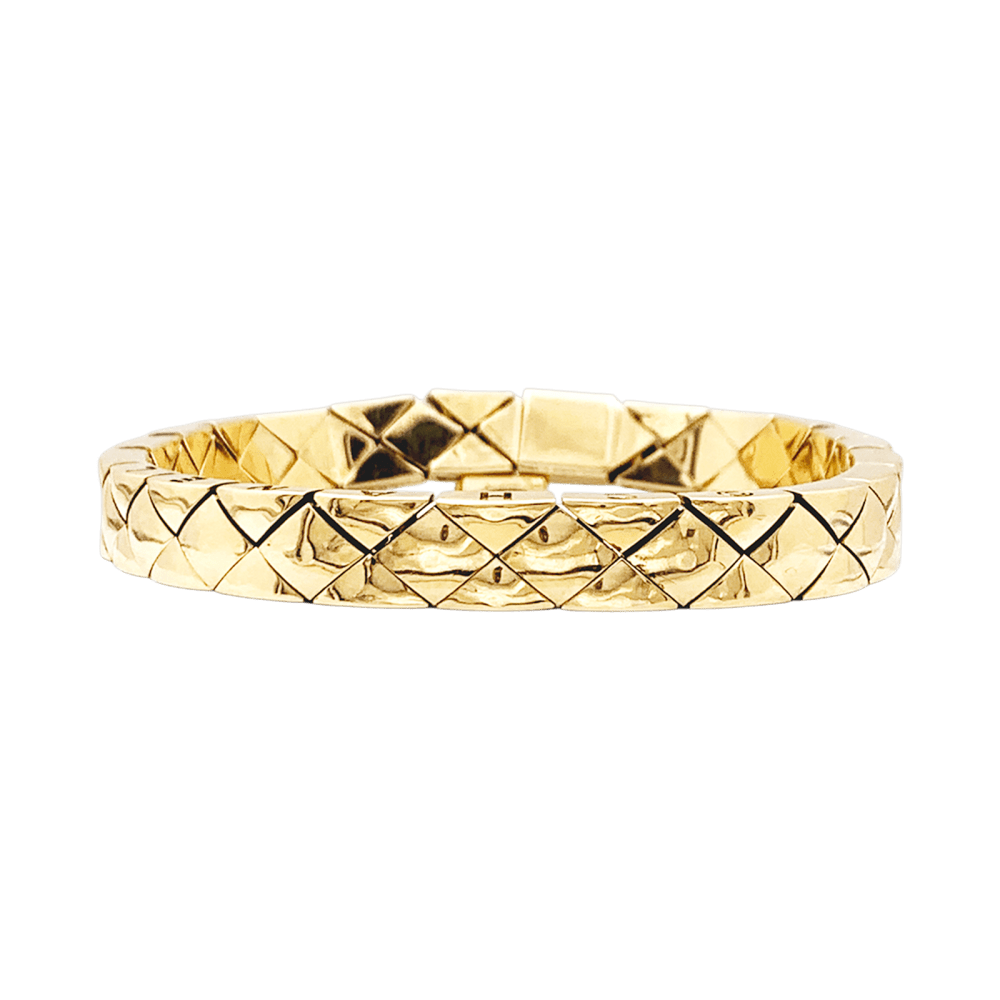 Bracelet Chanel, "Matelassé", or jaune.   1