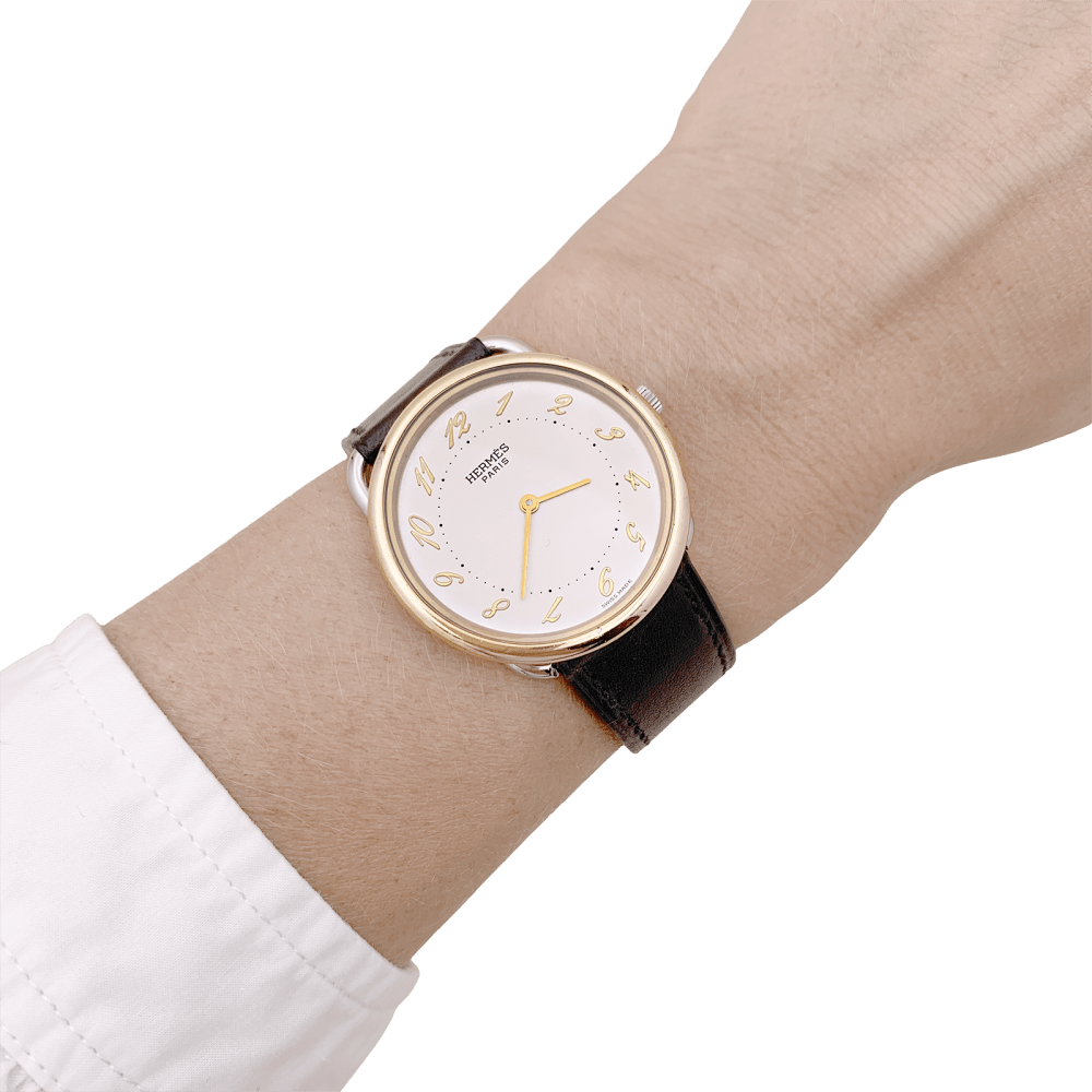 Montre HERMÈS, "Arceau", plaqué or et acier. 6