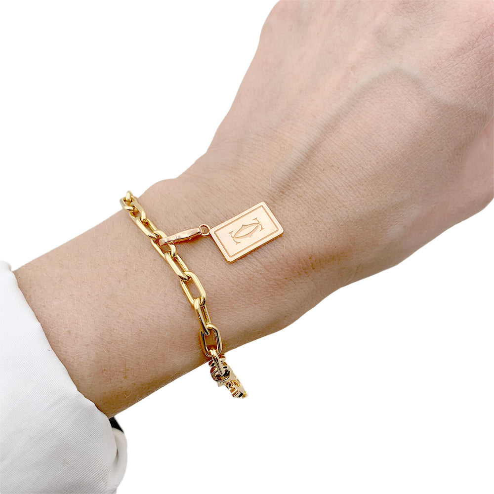 Bracelet Cartier breloques. 8