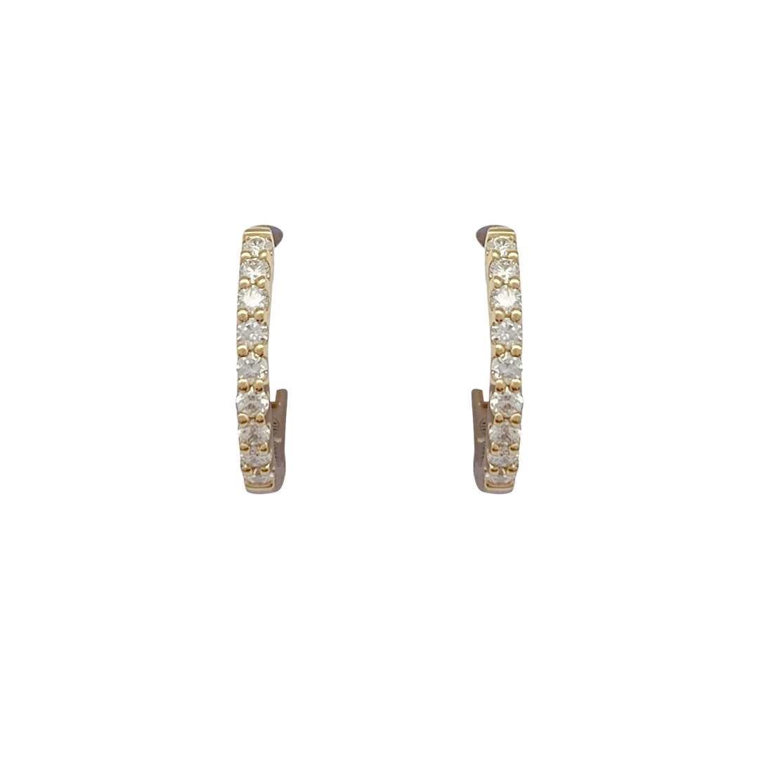 Pair of small yellow gold hoop earrings with diamonds.