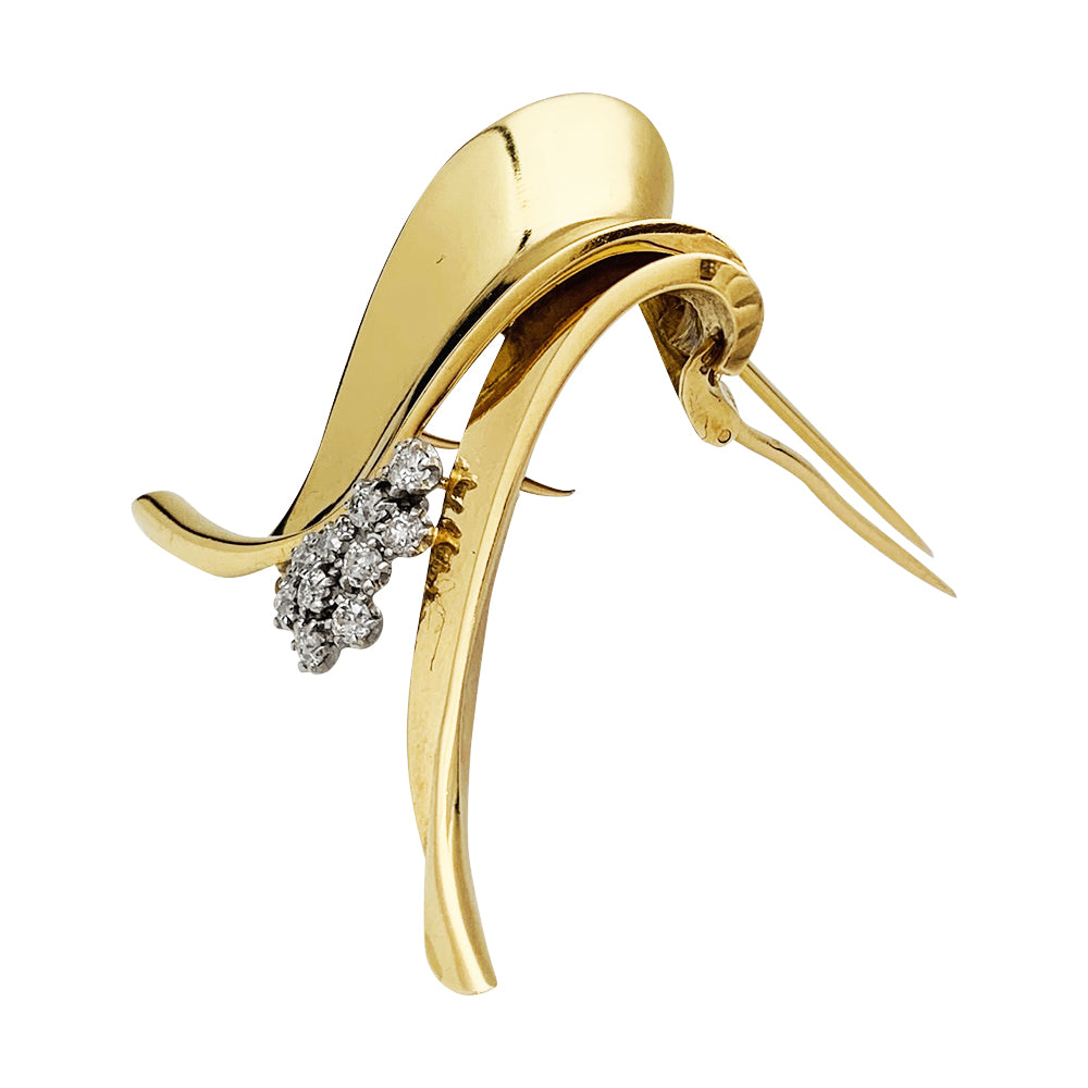 Broche Fontana en or jaune 750/000 et platine 950/000 sertie de 10 diamants taille ancienne. Poids brut : 11,4 grammes. 2
