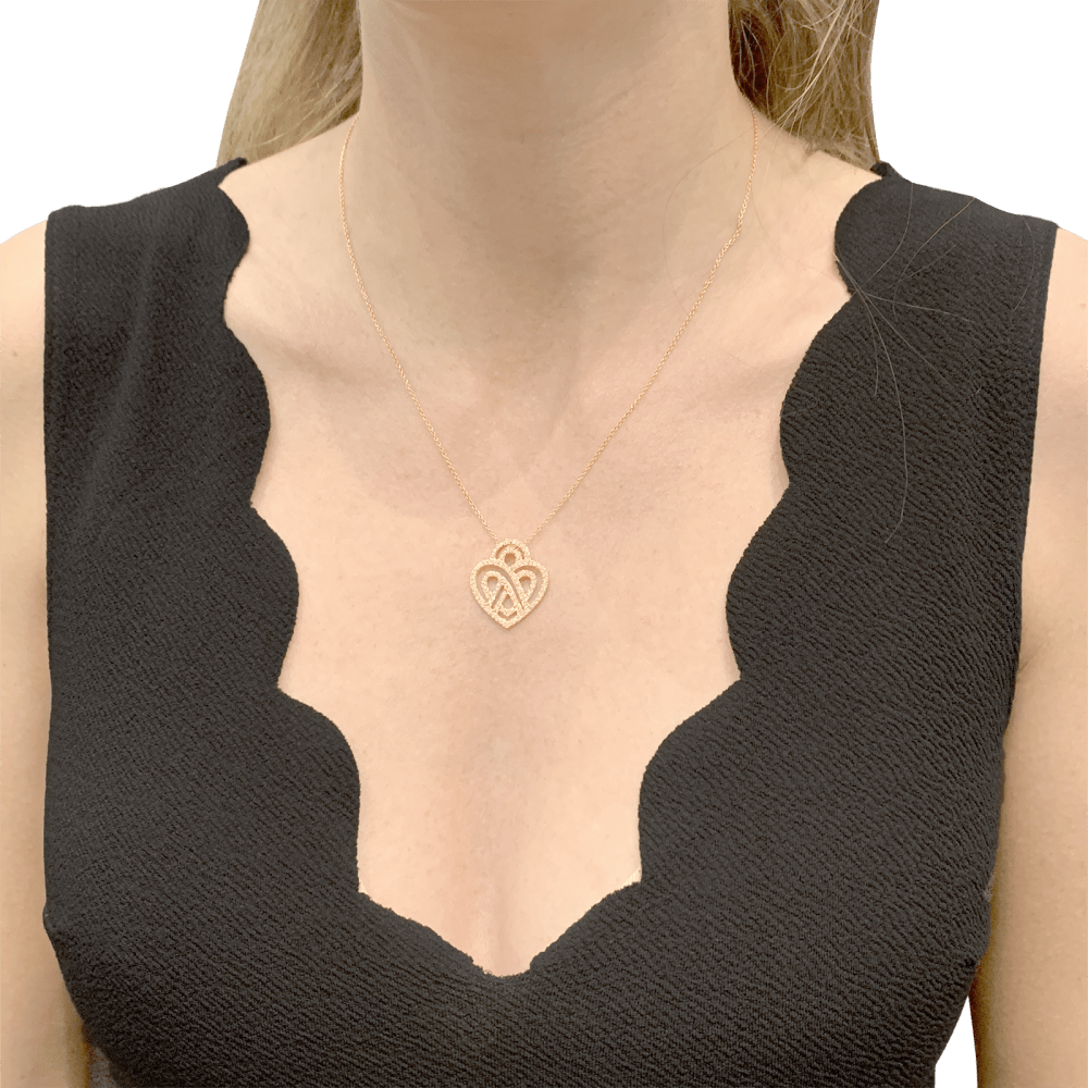 Collier Poiray, "Coeur entrelacé", or rose et diamants.  5