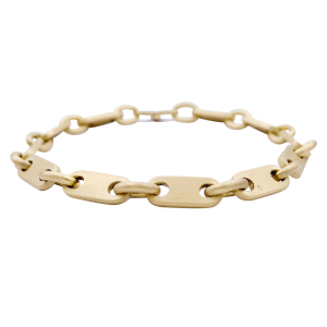Hermès gold bracelet.