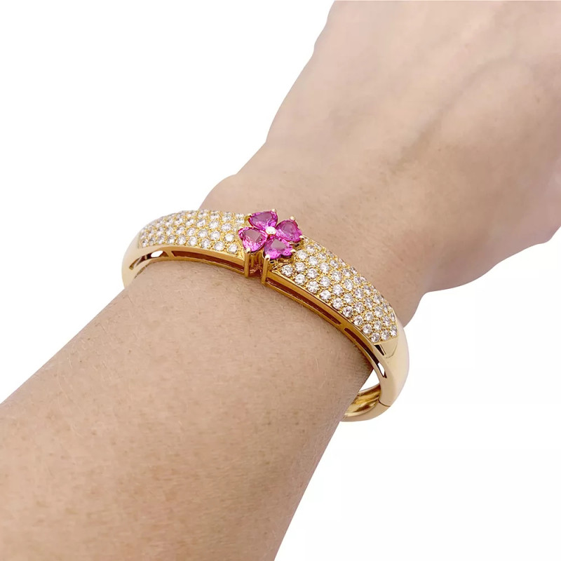 Van Cleef & Arpels yellow gold, diamonds, pink sapphires bangle bracelet.