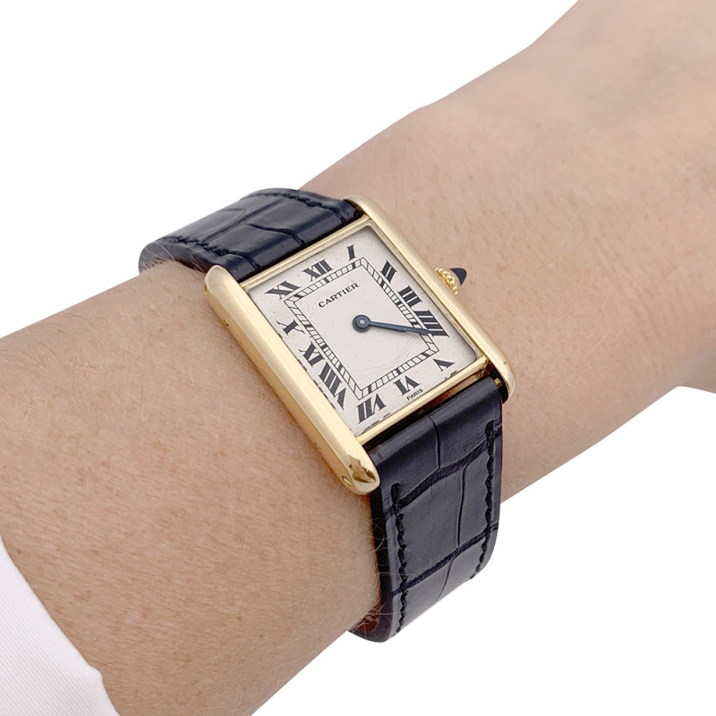 Cartier gold watch, "Tank Louis Cartier" collection.