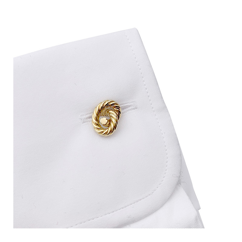 Hermès gold "Knots" cufflinks.