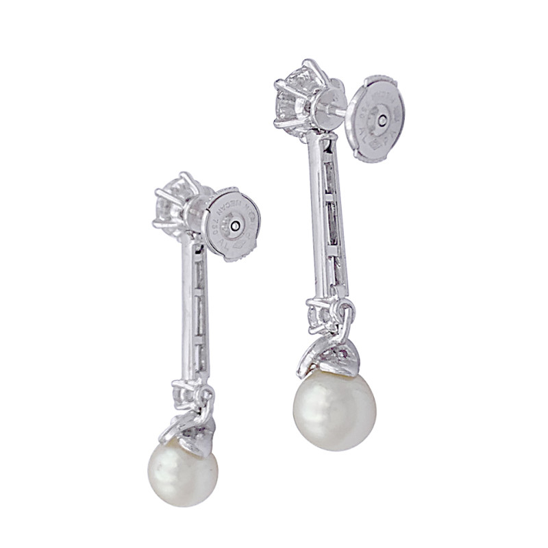 Platinum dangling earrings, pearls and diamonds.