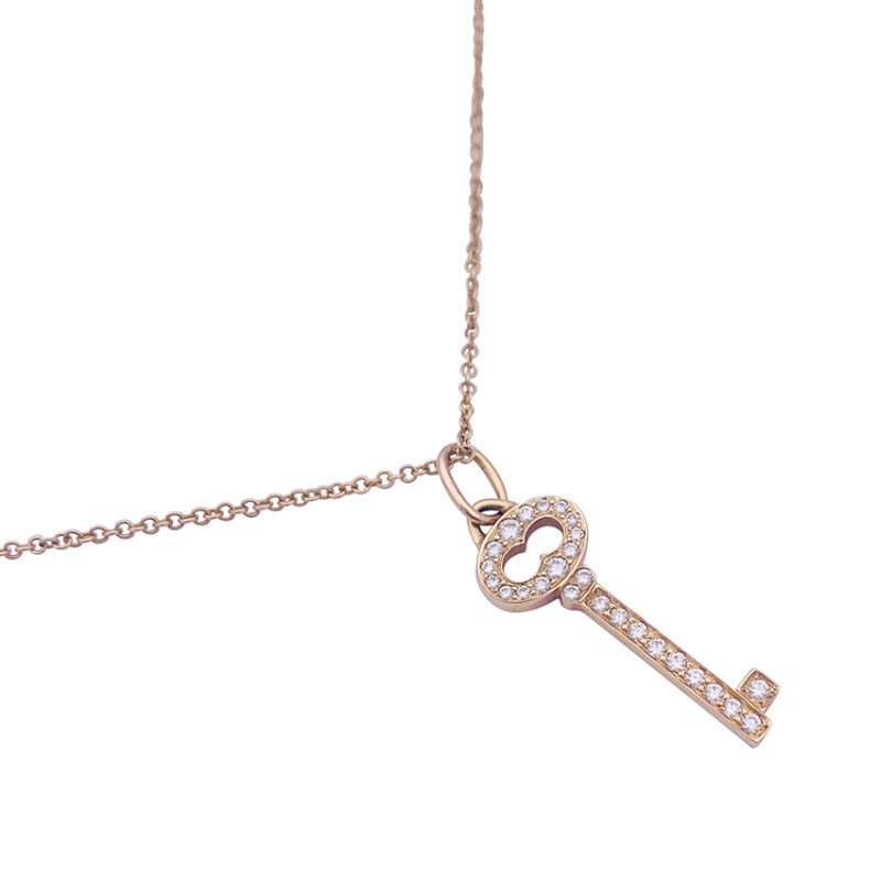 Collier Tiffany & Co. "Clef" or rose, diamants.