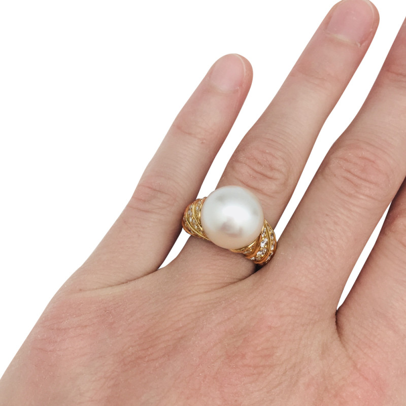 A yellow gold Tabbah ring, white pearl and diamonds.