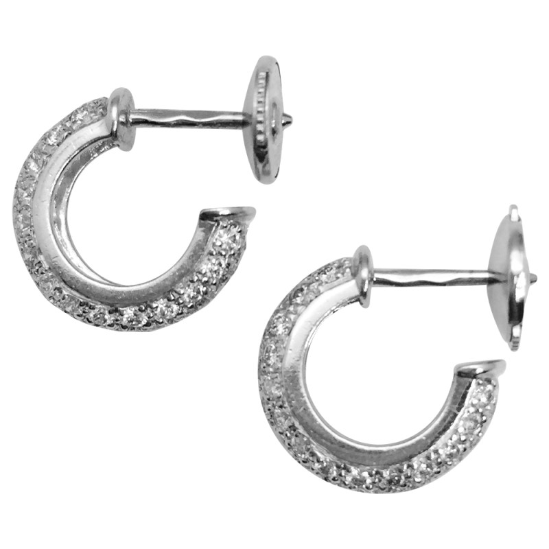 Boucles d'oreilles Cartier, modèle " Etincelle", diamants et platine.