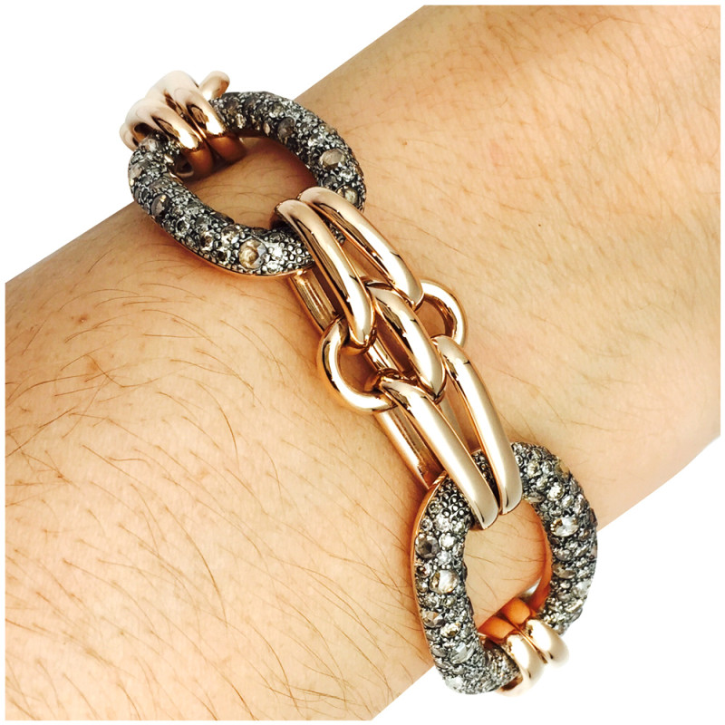Bracelet Pomellato, modèle "Tango" en or rose, argent et diamants bruns.