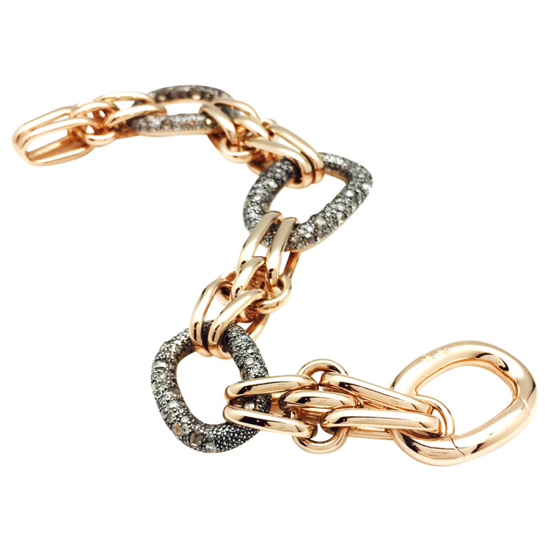 Bracelet Pomellato, modèle "Tango" en or rose, argent et diamants bruns.
