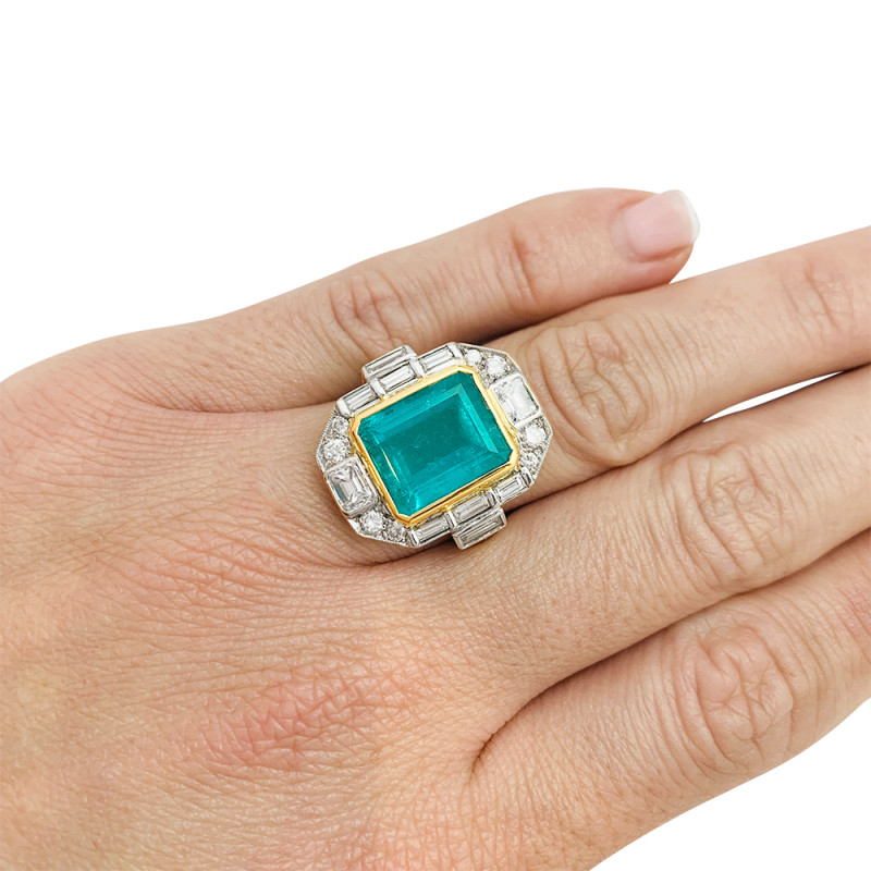 Two golds emerald ring, diamonds.