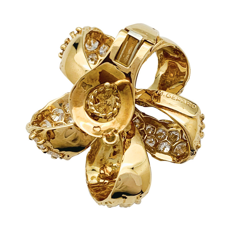 M.Gérard earrings, yellow gold ribbon flowers set with diamonds.